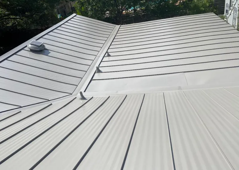 Solar attic fan installed on a metal roof for Roof Ventilation in Bayville